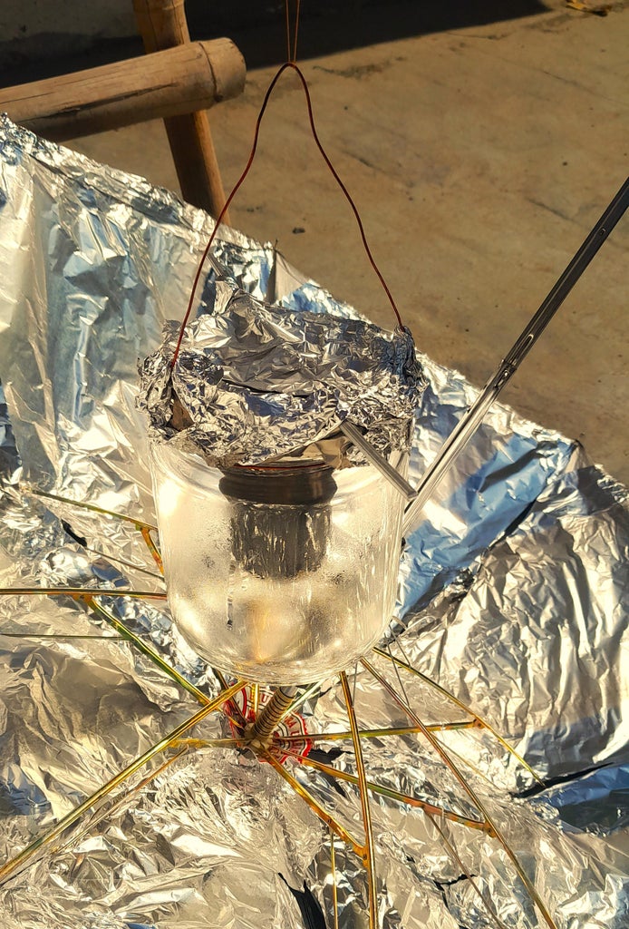 "Sun-Brella Greenhouse Effect Cooker": Working Solar Cooker for the Vulnerable, Refugees, Eco-Enthusiasts and Creative Cooks